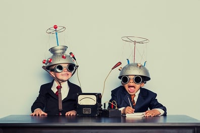Two young boys perform an experiment with B2B emails