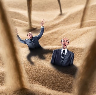 Man drawing in the heavy sands of graphic design pitfalls