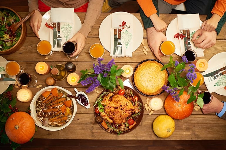 Thanksgiving dinner table full of food